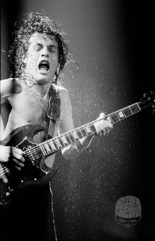 Angus Young, AC/DC, UK tour, 1981, by Michael Putland