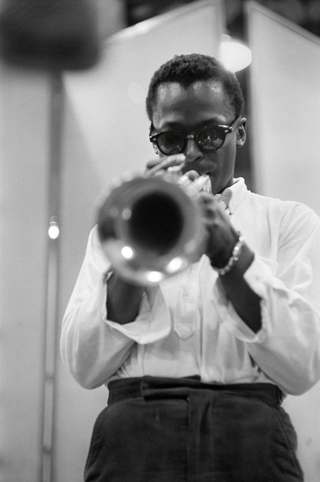 Miles Davis playing the trumpet